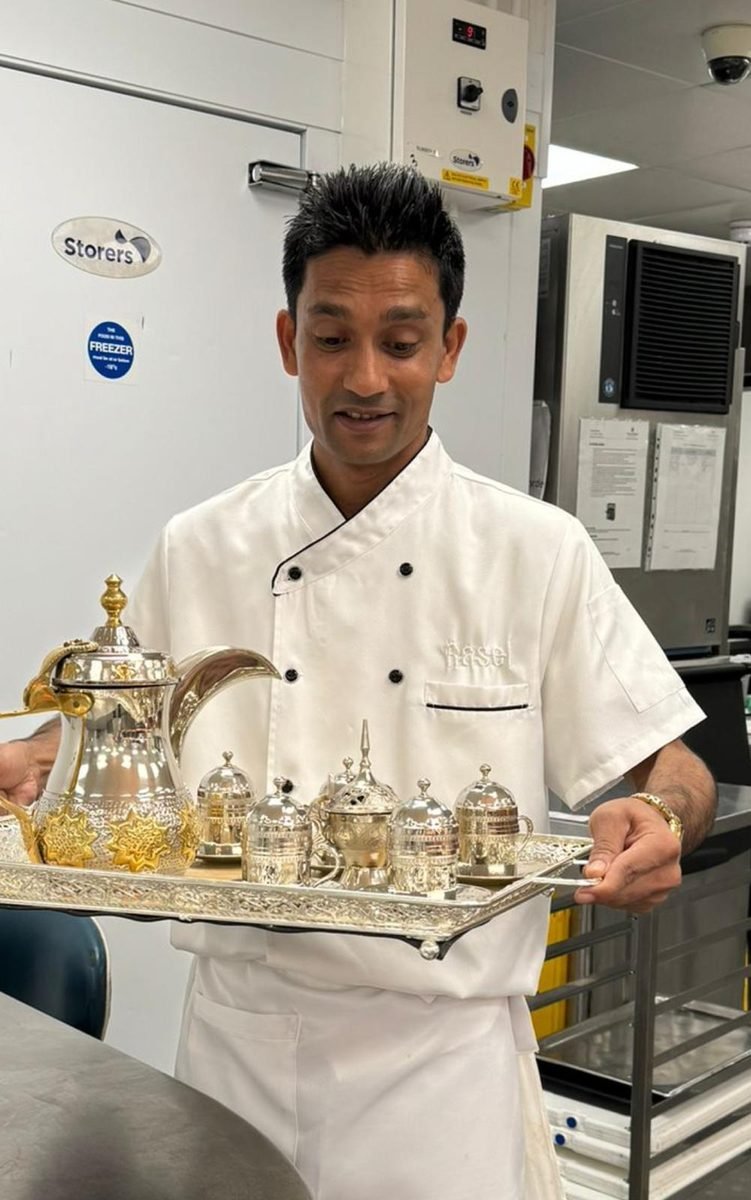 Carrying the coffee service through the kitchen